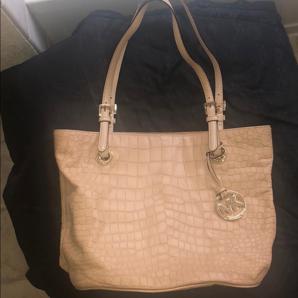 Michael Kors beige purse.